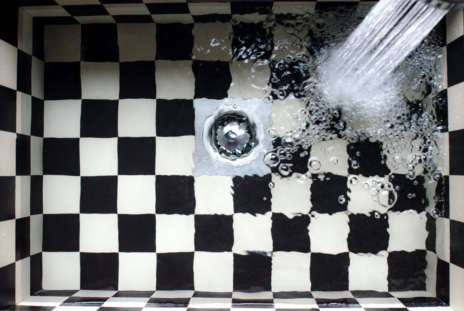 Kitchen sink strainer catching food waste