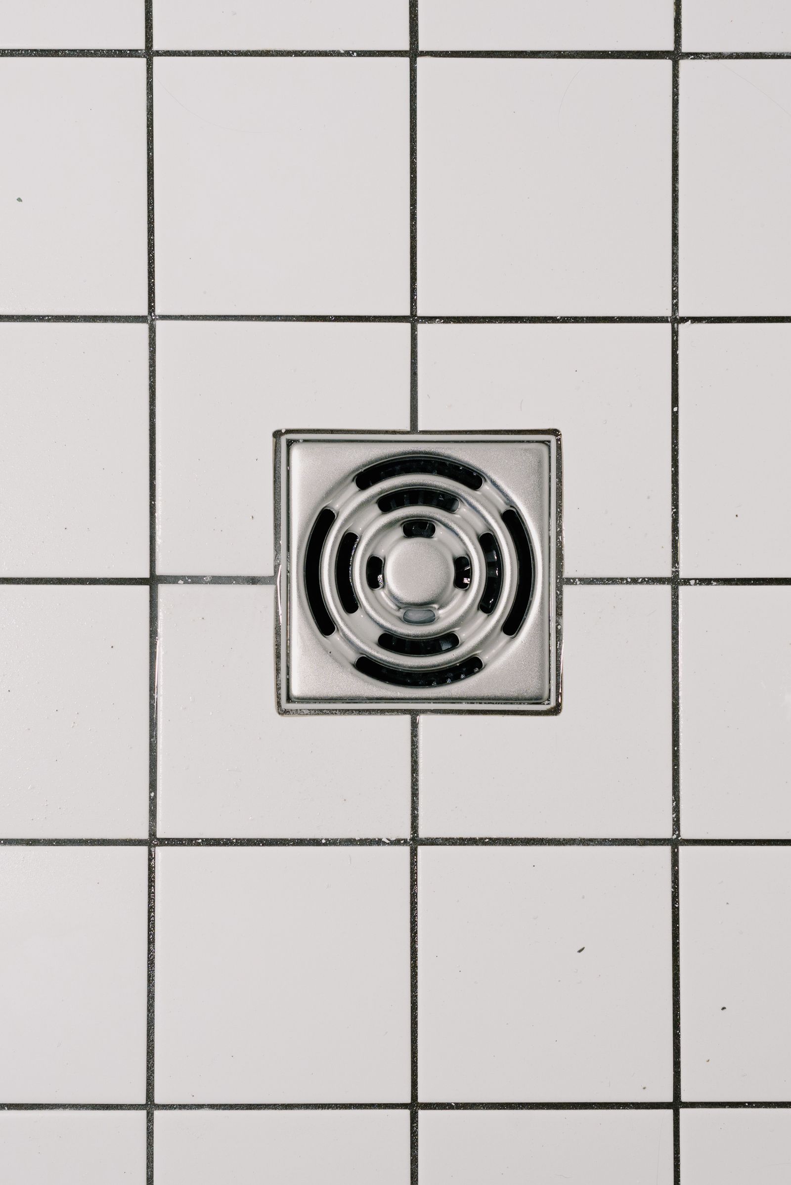 Close view of a shower floor drain